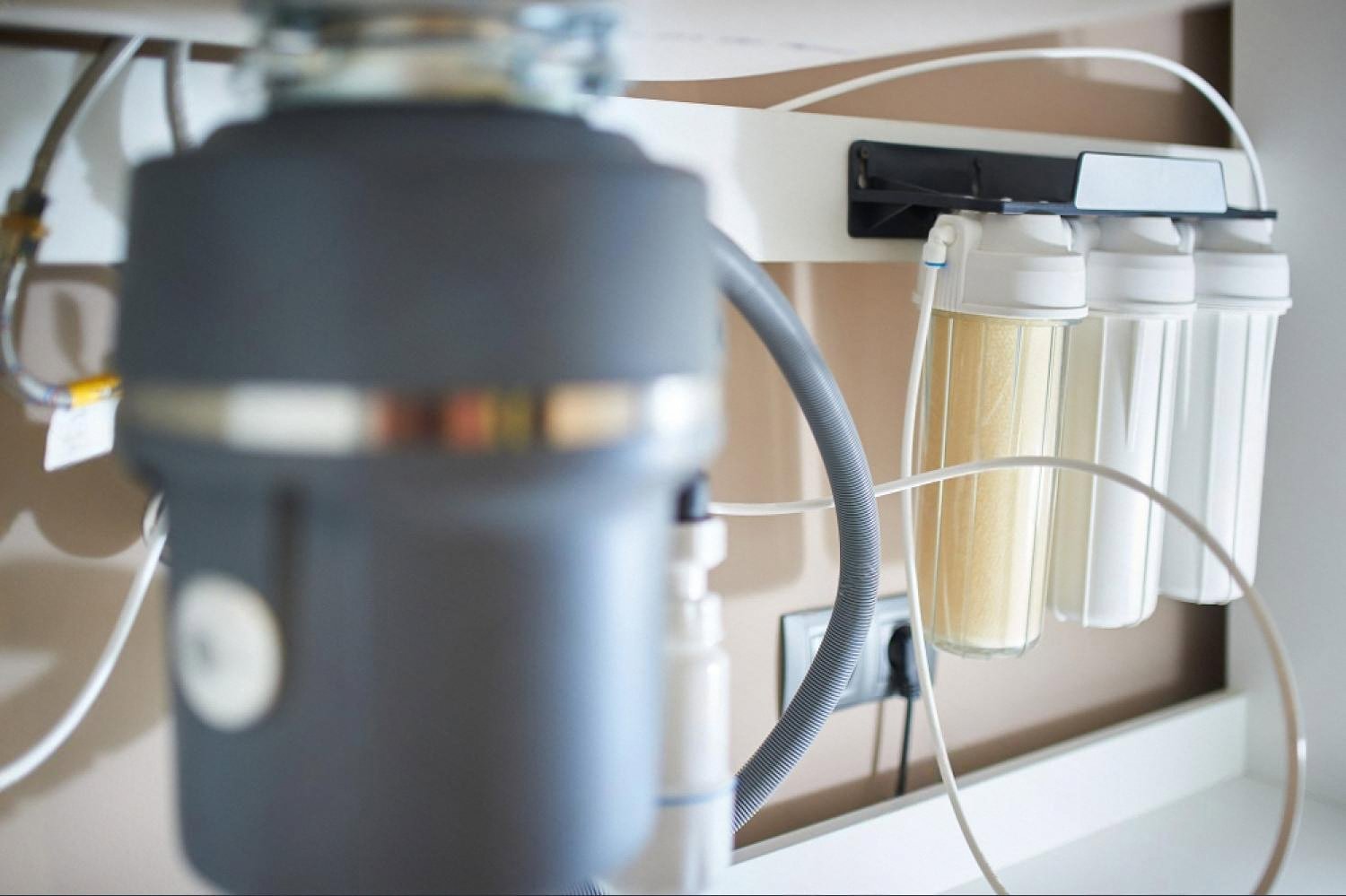 Under-sink water filter and disposal unit in a UAE home connected to the main tank supply